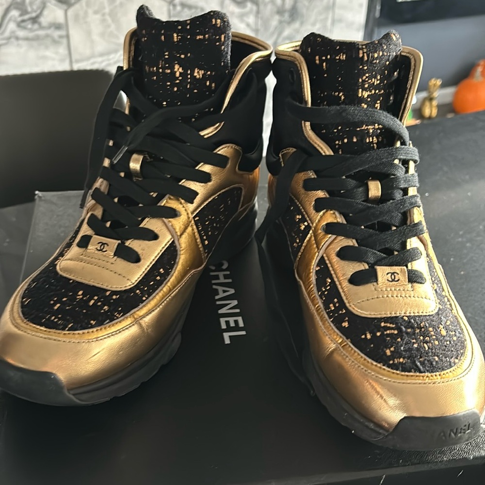 Gold and black high top sneakers